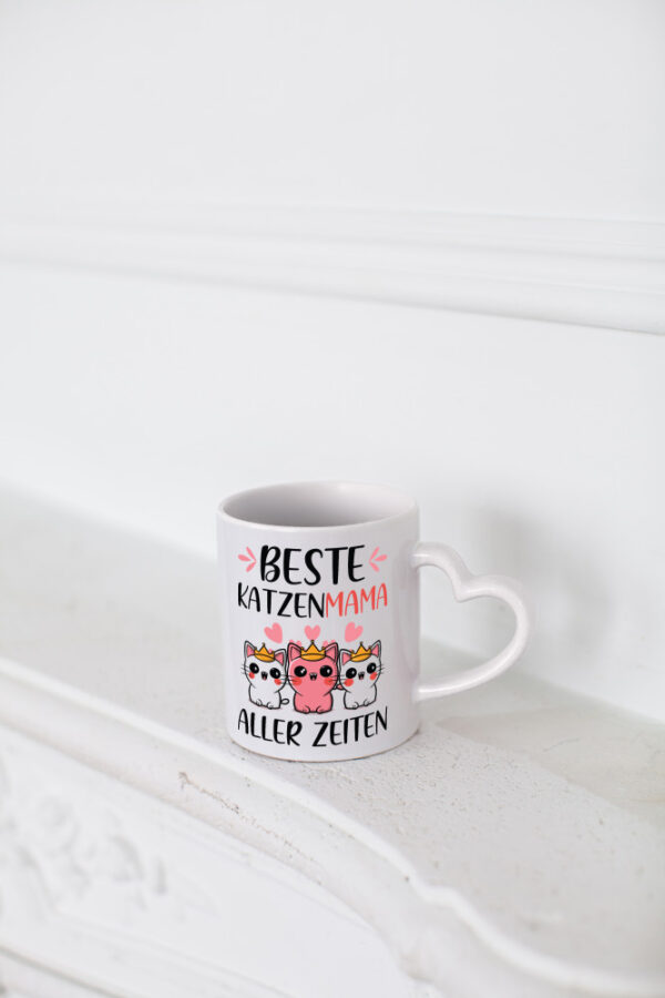 Beste Katzenmama aller Zeiten | Katzenliebhaberin - Herzhenkel Tasse - Kaffeetasse / Geschenk / Familie