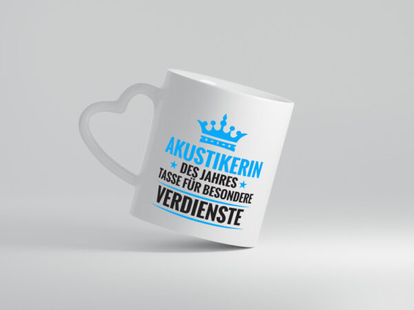 Besonderer Verdienst: Akustikerin | Hörgeräteakustik - Herzhenkel Tasse - Kaffeetasse / Geschenk / Familie