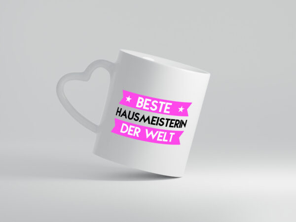 Beste Hausmeisterin | Hauswart - Herzhenkel Tasse - Kaffeetasse / Geschenk / Familie