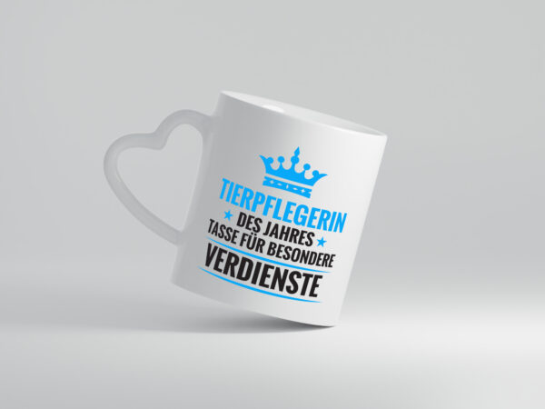 Besonderer Verdienst: Tierpflegerin | Pflegeberuf | Tierheim - Herzhenkel Tasse - Kaffeetasse / Geschenk / Familie