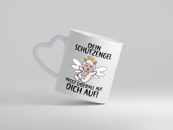 Dein Schutzengel passt auf | Sheepworld | Schaf | Comic - Herzhenkel Tasse - Kaffeetasse / Geschenk / Familie