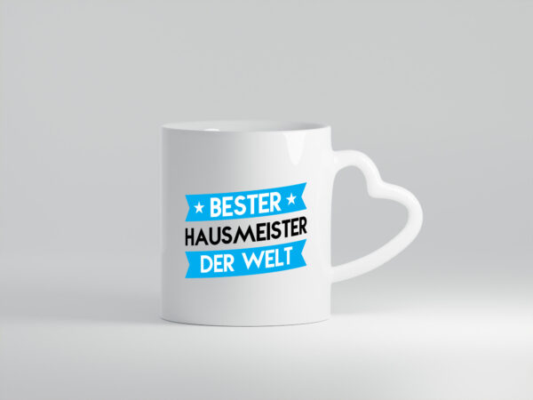 Bester Hausmeister | Hauswart - Herzhenkel Tasse - Kaffeetasse / Geschenk / Familie