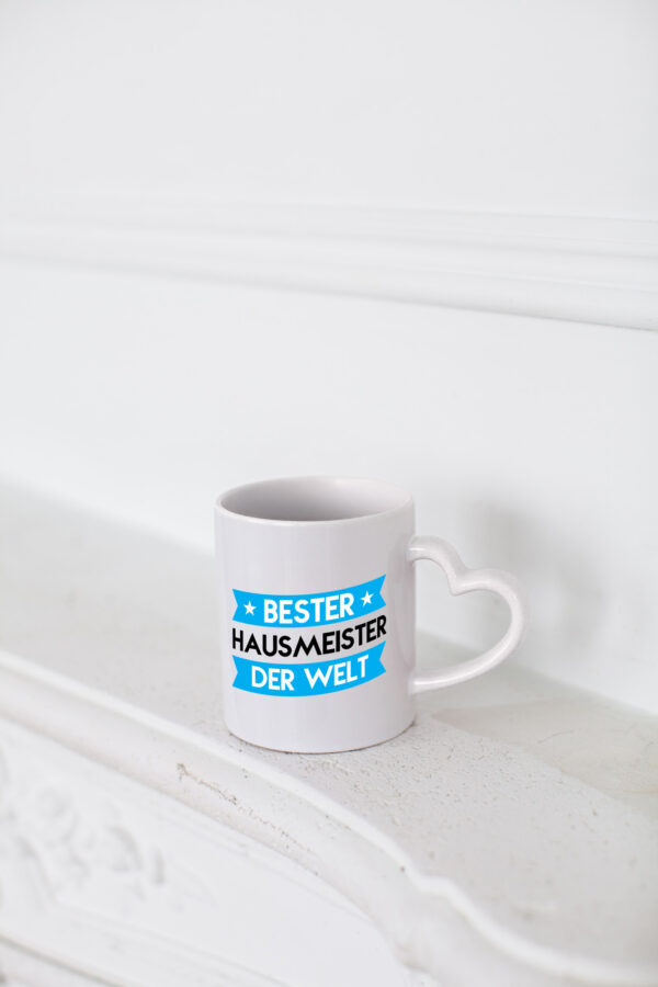 Bester Hausmeister | Hauswart - Herzhenkel Tasse - Kaffeetasse / Geschenk / Familie