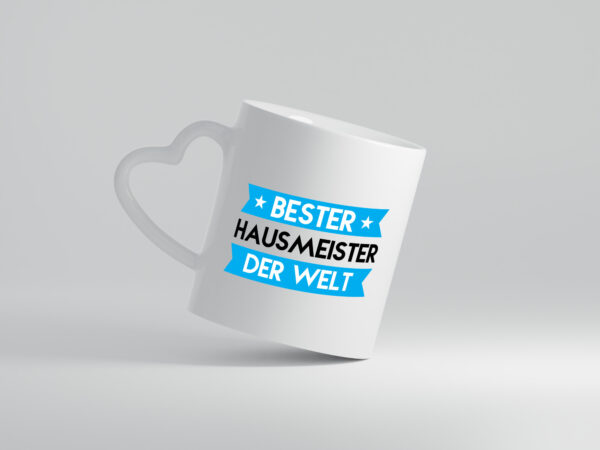 Bester Hausmeister | Hauswart - Herzhenkel Tasse - Kaffeetasse / Geschenk / Familie