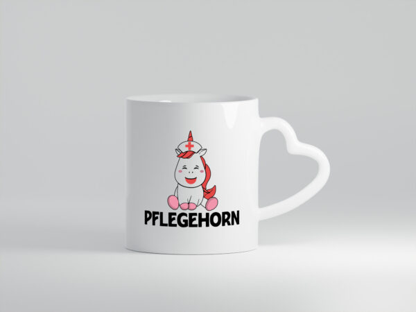 Pflegehorn | Krankenpflegerin | Einhorn - Herzhenkel Tasse - Kaffeetasse / Geschenk / Familie