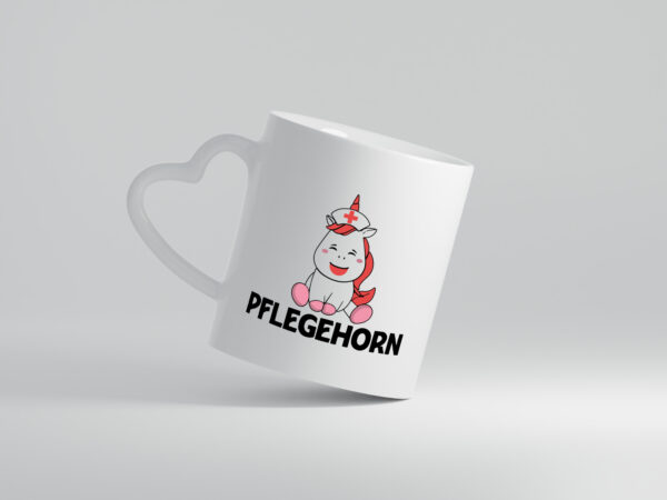 Pflegehorn | Krankenpflegerin | Einhorn - Herzhenkel Tasse - Kaffeetasse / Geschenk / Familie